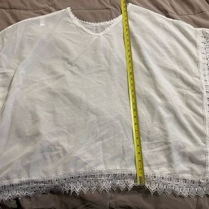 Sheer light weight poncho or bathing suit cover up with lace trim
